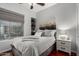 This cozy bedroom features a ceiling fan, carpeted floors, and a window with Roman shades at 1919 E Gary Way, Phoenix, AZ 85042