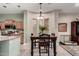 Inviting dining area with a view of the kitchen, complete with a dark wood table and decorative accents at 1919 E Gary Way, Phoenix, AZ 85042