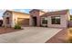 Beautiful home showcasing a spacious driveway, desert landscaping, and a welcoming exterior at 1919 E Gary Way, Phoenix, AZ 85042