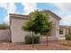 Beautiful home showcasing desert landscaping in the front yard, mature trees, and well-maintained bushes at 1919 E Gary Way, Phoenix, AZ 85042
