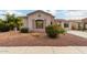 Charming home featuring decorative shutters, lovely landscaping, and a well maintained desert front yard at 1919 E Gary Way, Phoenix, AZ 85042