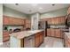 Updated kitchen with stainless steel appliances, granite countertops, and a center island at 1919 E Gary Way, Phoenix, AZ 85042