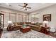 Comfortable living room with a large sectional sofa, decorative rug, and warm lighting at 1919 E Gary Way, Phoenix, AZ 85042
