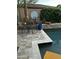 Charming outdoor patio with dining set, decorative clock and a view of the refreshing pool at 1919 E Gary Way, Phoenix, AZ 85042