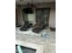 Outdoor patio featuring comfortable lounge chairs, a table, and a view of the pool for relaxation at 1919 E Gary Way, Phoenix, AZ 85042