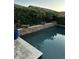 Beautiful pool with stone accents, lush greenery and tropical plants creating a tranquil outdoor oasis at 1919 E Gary Way, Phoenix, AZ 85042