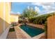 Landscaped pool area features lush vegetation and travertine stone at 1919 E Gary Way, Phoenix, AZ 85042