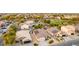An aerial view showcasing well-maintained homes, desert landscaping and a community park nearby at 1942 E Connemara Dr, San Tan Valley, AZ 85140