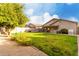 Spacious backyard with lush green grass and a gravel border, perfect for outdoor activities at 1942 E Connemara Dr, San Tan Valley, AZ 85140