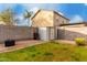 Large backyard with a storage shed, gravel area, and grassy lawn, offering ample space for outdoor activities at 1942 E Connemara Dr, San Tan Valley, AZ 85140