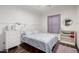 This is an intimate bedroom with light purple walls, a window, and stylish decor at 1942 E Connemara Dr, San Tan Valley, AZ 85140