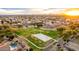 A scenic aerial view showing the community park with a splash pad, walking trails, and lush greenery at 1942 E Connemara Dr, San Tan Valley, AZ 85140