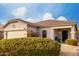 Charming home with desert landscaping, tile roof, and covered front porch at 1942 E Connemara Dr, San Tan Valley, AZ 85140