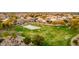 Aerial view of the neighborhood park with basketball courts and walking trails perfect for outdoor activities at 1942 E Connemara Dr, San Tan Valley, AZ 85140