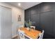 Cozy dining area featuring stylish wood paneled accent wall and a modern aesthetic at 19601 N 7Th St # 1012, Phoenix, AZ 85024