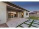 Outdoor patio with tile pavers and modern landscaping, perfect for relaxation and entertaining guests at 21765 E Arroyo Verde Dr, Queen Creek, AZ 85142