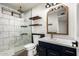 This bathroom features a glass walk-in shower, with sleek, modern fixtures and floating shelves at 2228 N 52Nd St # 245, Phoenix, AZ 85008