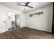 Spacious bedroom with wood flooring, ceiling fan, and closet with sliding mirrored doors at 2228 N 52Nd St # 245, Phoenix, AZ 85008