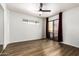 Bright bedroom with wood floors, ceiling fan, closet and sliding glass door to private patio at 2228 N 52Nd St # 245, Phoenix, AZ 85008