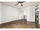 This bedroom includes a ceiling fan, access to the en suite bath, and walk-in closet at 2228 N 52Nd St # 245, Phoenix, AZ 85008