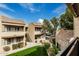 Well-maintained apartment complex featuring multiple floors, landscaping, and a green lawn at 2228 N 52Nd St # 245, Phoenix, AZ 85008