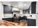 Charming kitchen with butcher block island, modern appliances, and ample cabinet space at 2228 N 52Nd St # 245, Phoenix, AZ 85008