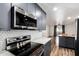 Kitchen features stainless appliances, gray cabinetry, white countertops and backsplash and an open floorplan at 2228 N 52Nd St # 245, Phoenix, AZ 85008