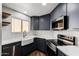 Updated kitchen features stainless steel appliances, sleek cabinetry, and stylish countertops at 2228 N 52Nd St # 245, Phoenix, AZ 85008