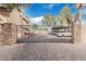 Gated parking area featuring covered parking spaces and lush landscaping at a luxury condo complex at 2228 N 52Nd St # 245, Phoenix, AZ 85008