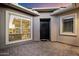 Inviting entryway with modern windows and gray brick, enhancing the home's curb appeal at 22421 N 34Th St, Phoenix, AZ 85050