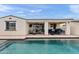 Charming outdoor patio with covered space, lounge seating and overlooking the sparkling pool at 22538 E Tierra Grande --, Queen Creek, AZ 85142