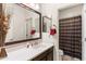 Bathroom featuring a sink, mirror, and a shower at 22538 E Tierra Grande --, Queen Creek, AZ 85142