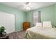 Bright bedroom featuring neutral carpet, ceiling fan, and double door closet at 22538 E Tierra Grande --, Queen Creek, AZ 85142