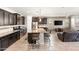 Open kitchen with granite countertops, an island with seating, and stainless steel appliances at 22538 E Tierra Grande --, Queen Creek, AZ 85142