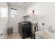 Clean laundry room with a utility sink, shelving, and modern appliances at 22538 E Tierra Grande --, Queen Creek, AZ 85142