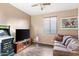 Cozy living room with a TV and a sofa at 22538 E Tierra Grande --, Queen Creek, AZ 85142