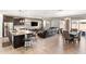 Open concept living space with a large kitchen, dining area, and leather sofa at 22538 E Tierra Grande --, Queen Creek, AZ 85142