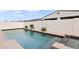 Sparkling pool with integrated spa and privacy wall creating a secluded backyard paradise at 22538 E Tierra Grande --, Queen Creek, AZ 85142