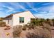 View of the back of the house, showing the desert landscaping at 22565 W La Pasada Blvd, Buckeye, AZ 85326