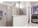 Bathroom featuring a tile shower with a glass partition and tiled walls at 22565 W La Pasada Blvd, Buckeye, AZ 85326