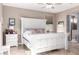 Well decorated main bedroom with a large bed and a full ensuite bathroom at 22565 W La Pasada Blvd, Buckeye, AZ 85326