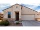 Charming single-story home with a two-car garage and low-maintenance desert landscaping at 22565 W La Pasada Blvd, Buckeye, AZ 85326