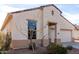 Charming single-story home with a two-car garage and low-maintenance desert landscaping at 22565 W La Pasada Blvd, Buckeye, AZ 85326