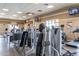 A modern gym featuring various weight training and cardio equipment, with televisions for entertainment at 22565 W La Pasada Blvd, Buckeye, AZ 85326