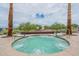 A bubbling hot tub promises relaxation and a spa-like experience in a tranquil setting at 22565 W La Pasada Blvd, Buckeye, AZ 85326