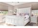 Comfortable main bedroom featuring a large bed frame, neutral tones, and great natural light at 22565 W La Pasada Blvd, Buckeye, AZ 85326