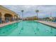 A sparkling pool surrounded by lounge chairs offers a refreshing spot for relaxation and recreation at 22565 W La Pasada Blvd, Buckeye, AZ 85326