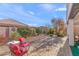 Beautifully landscaped backyard with hardscape, patio seating, and desert foliage at 22788 E Via Las Brisas --, Queen Creek, AZ 85142