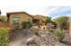 Landscaped backyard features covered patio, fire pit, and outdoor seating area at 2320 E Allen St, Phoenix, AZ 85042