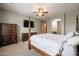 A well-lit bedroom includes a four-poster bed and a view into the en-suite bathroom at 2320 E Allen St, Phoenix, AZ 85042